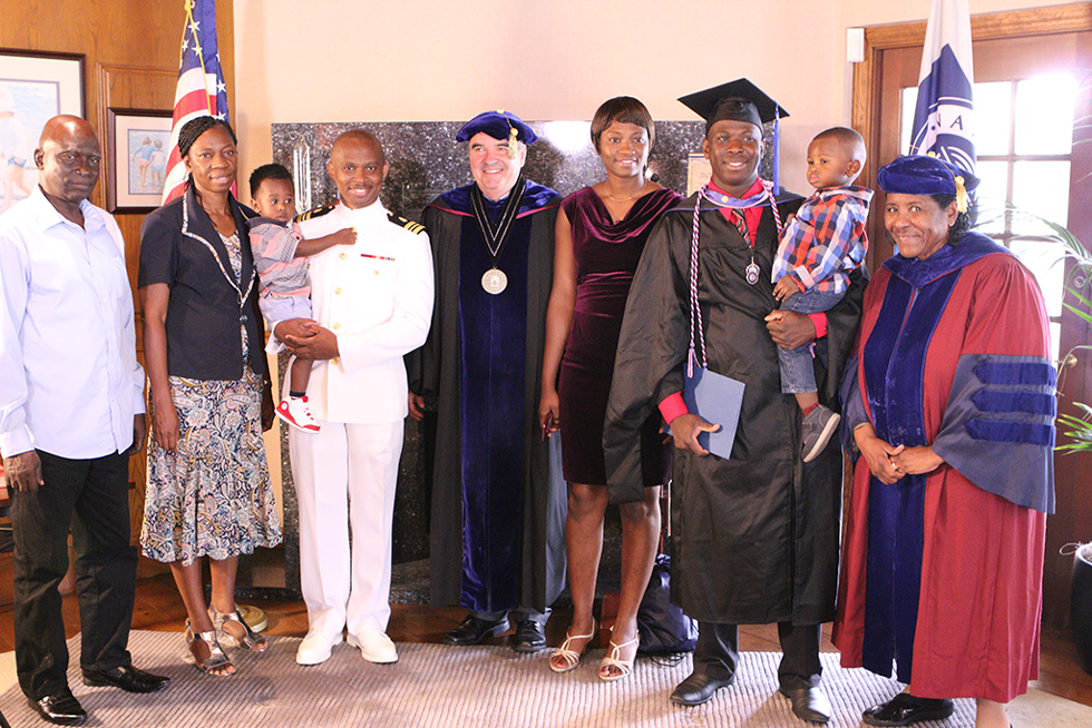 President Andrews and SHHS Dean Gloria McNeal at a special ceremony for graduate Francis Oladipo, who serves with the U.S. Navy.