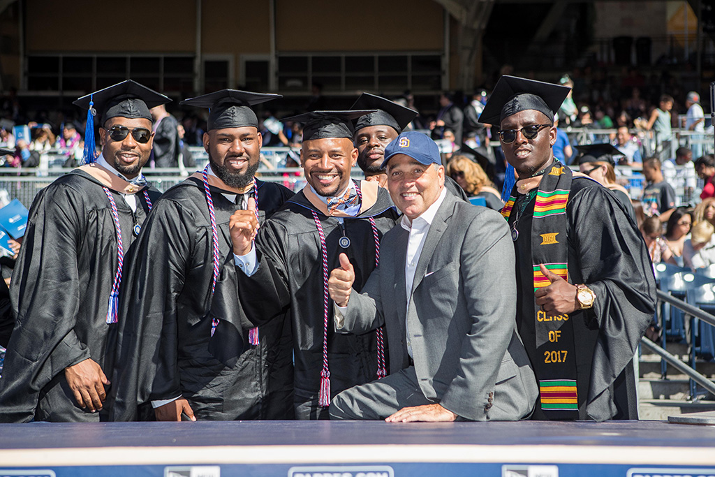 Veteran grads from NU’s School of Business & Management celebrate with Chancellor Cunningham at Petco Park.