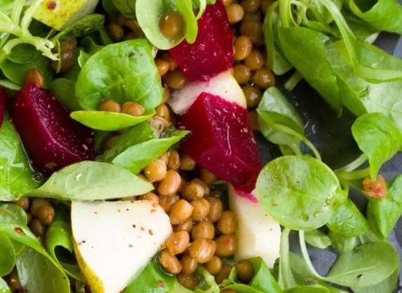 closeup of pear and beet green salad