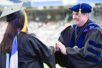 President Andrews congratulating graduates at 2016 Southern Commencement at Petco Park