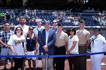 President Andrews pictured with recipients of National University's Military Scholarship at Petco Park.