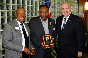 Douglas Barr (center) honored at NU's 2016 Veterans' Day Recognition Ceremony with President Andrews and Vernon Taylor, AVP of Regional Operations, Military & Veteran's Programs.