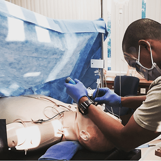 a man complete high-fidelity training in a simulation lab