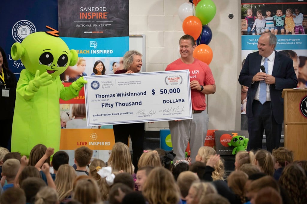 Tom Whisinnand of Nebraska named first-ever Grand Prize recipient of the National University-Sanford Teacher Award. Award presented by National University President Dr David Andrews and Dr Judy Mantle, dean National University’s Sanford College of Education