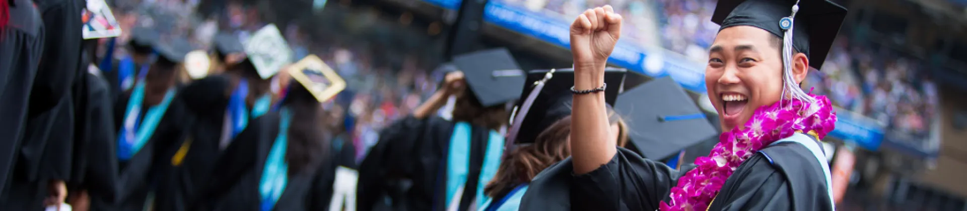 people celebrating earing their new year’s education resolution degree goals