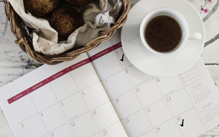 Calendar with coffee on top