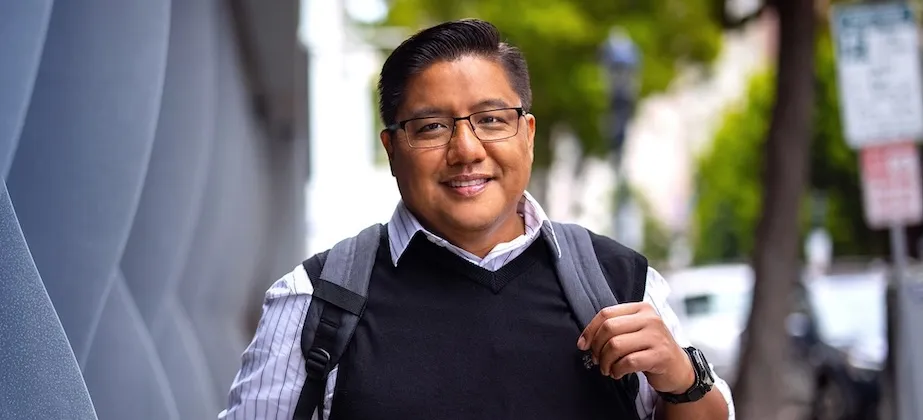 person outside walking with backpack on