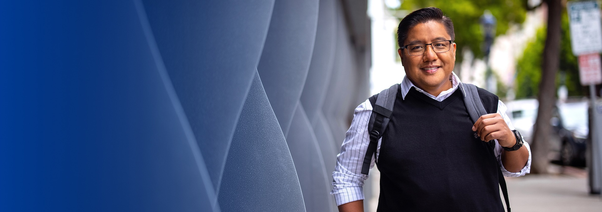 person outside walking with backpack on