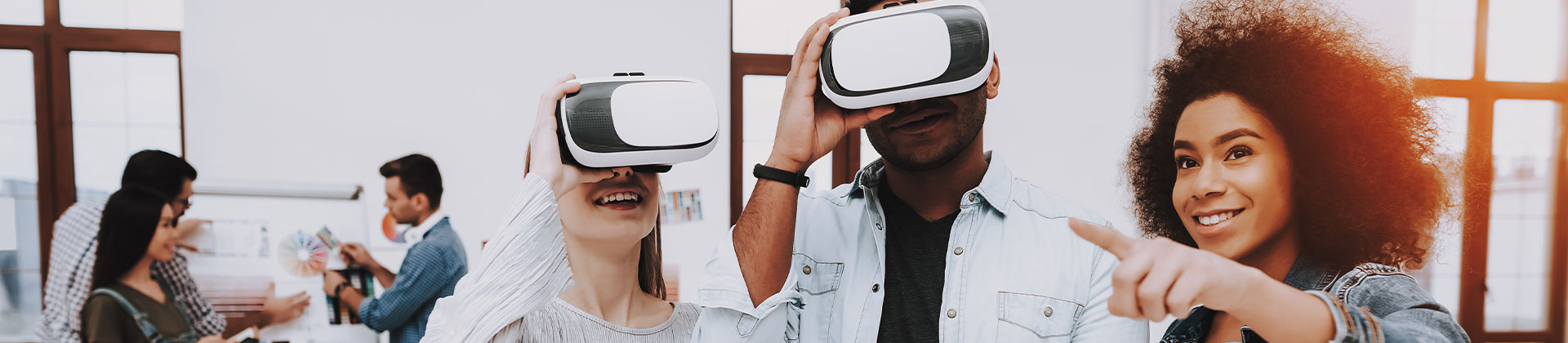 3 people in office, two of them wearing vr headsets working on a Bachelor of Arts in Digital Media Design