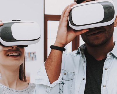 3 people in office, two of them wearing vr headsets