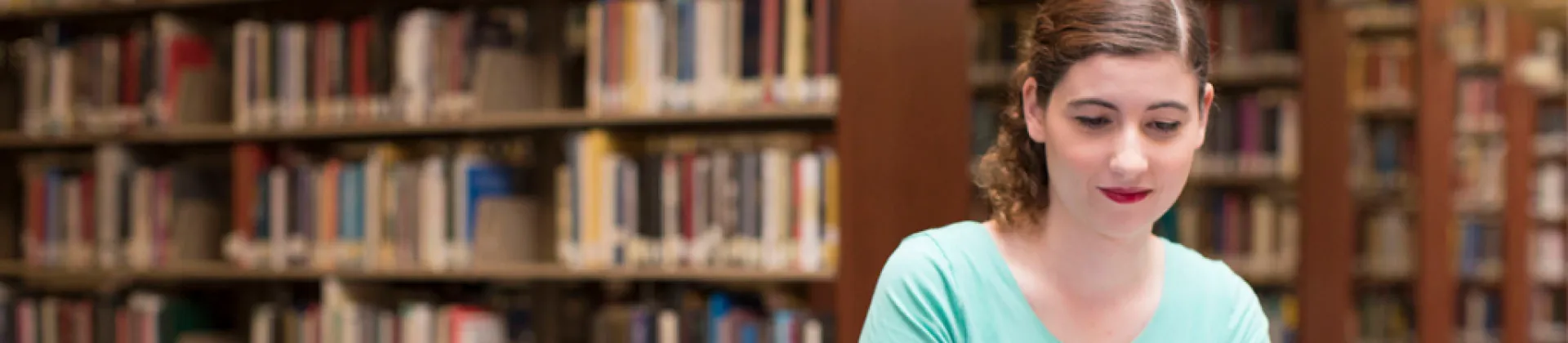 Person sitting in Library, thinking about What Can You Do With a Bachelor's Degree in History?