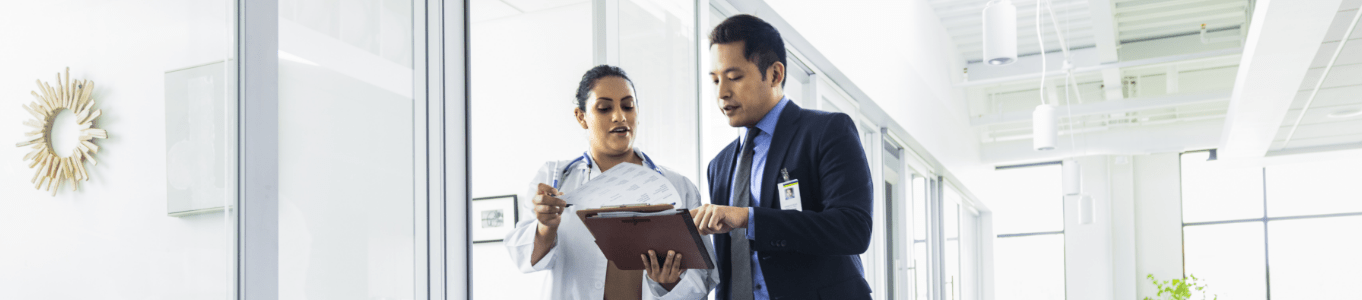 a nurse practitioner and doctor talking