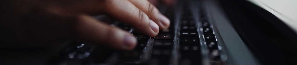 close up for fingers on keyboard