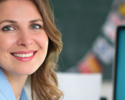 woman turned to look at camera and smiling