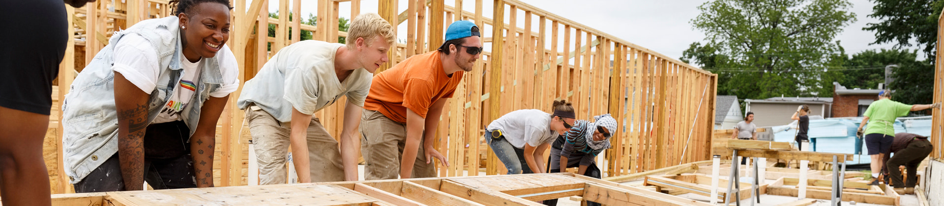 a group of volunteers building a home