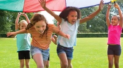 Learning Theories Theories of Learning in Education in practice with school children running under a tarp