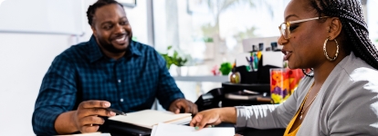 man and a woman sitting at a desk