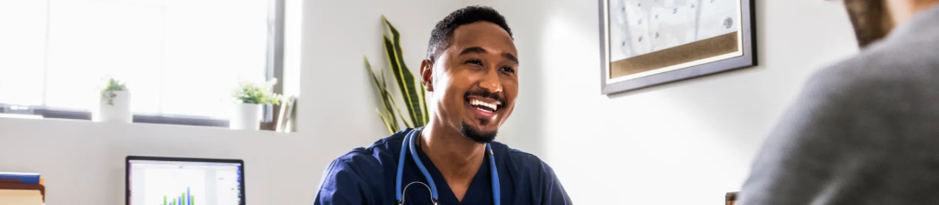 Doctor in office talking to patient