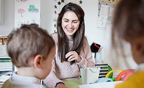 Teacher in class with children