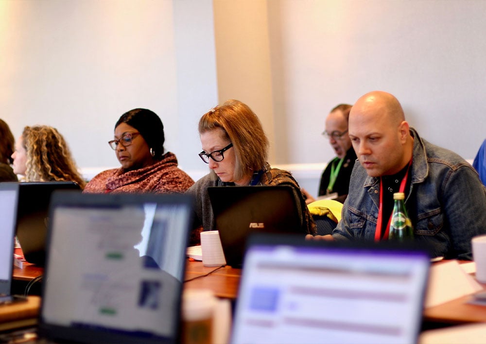 People working on laptops at dissertation boot camp