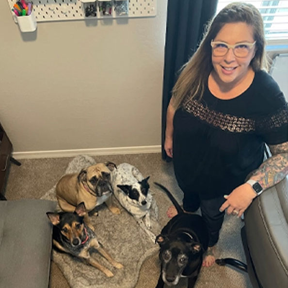 Julie D. photo of her and her three dogs