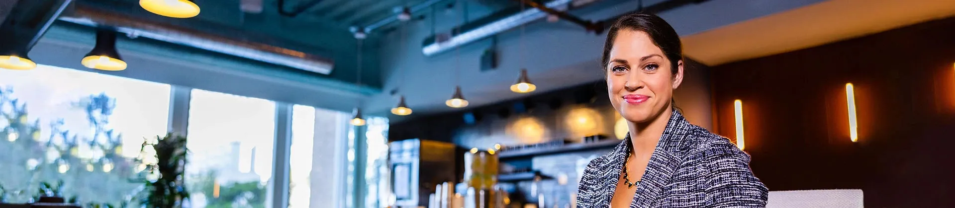 woman stands in a coffee shop