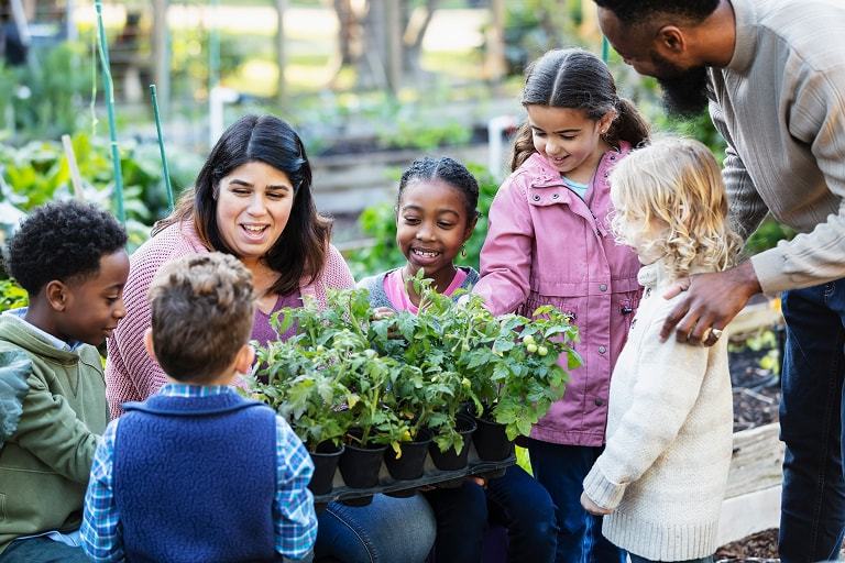 teacher with students in garden