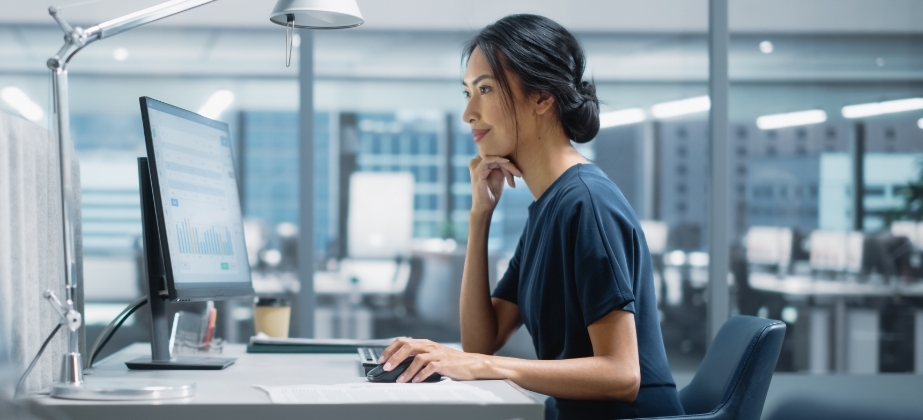 Woman working on computer in their office