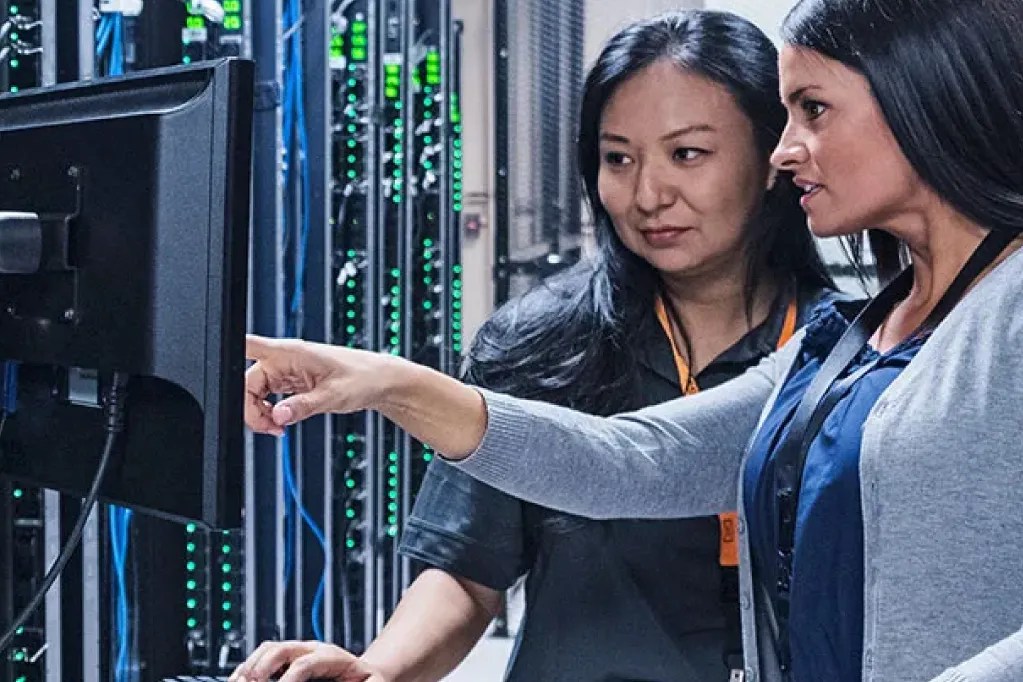 two IT professionals in server room