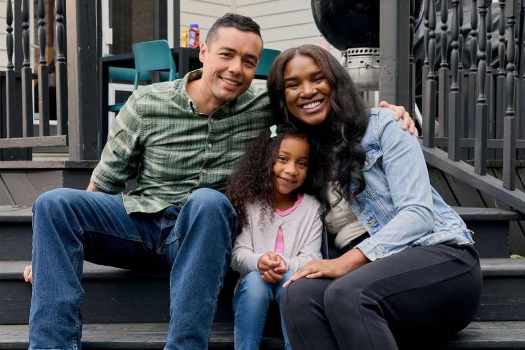 family sitting on porch
