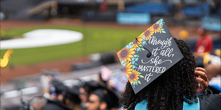 graduating student in cap and gown