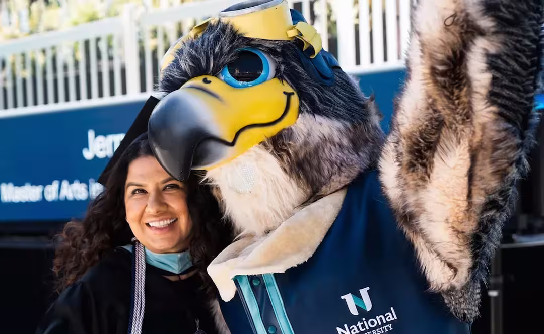 Navi, National University's mascot with graduating student