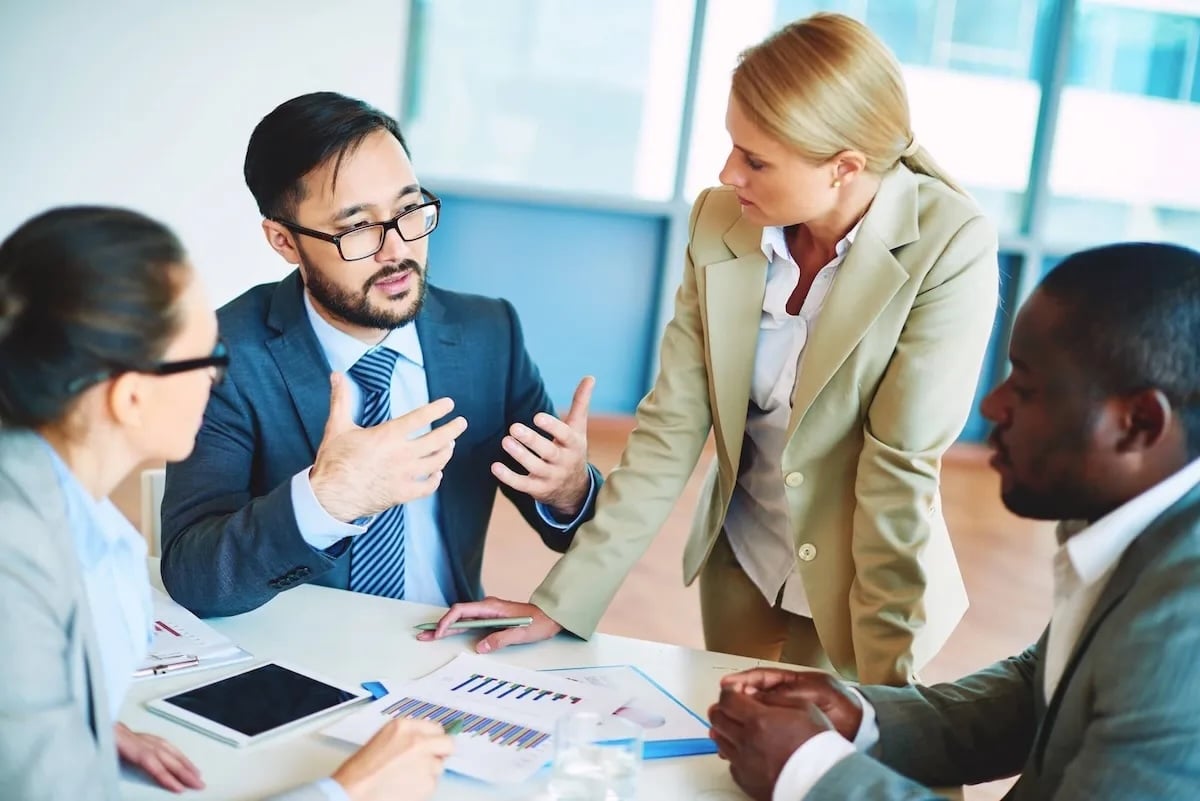 group of work colleagues in office meeting room