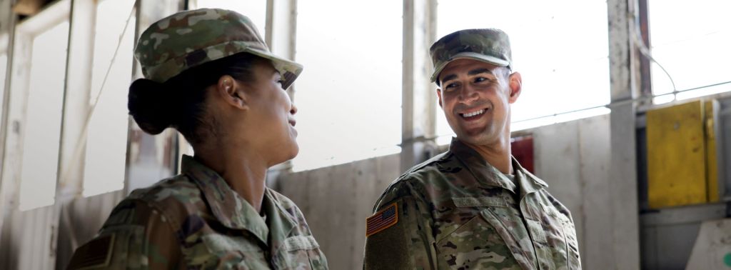 two people in military uniforms talking