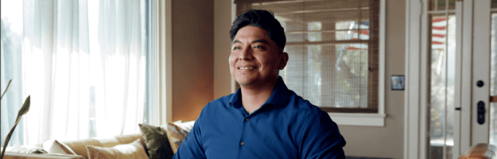 A Hispanic man with a proud look and posture.